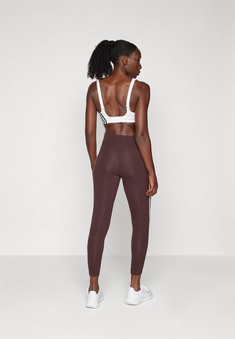 adidas Sportswear adidas Sportswear ESSENTIALS 3 STRIPES HIGH WAISTED - Leggings - shadow brown Black Friday
