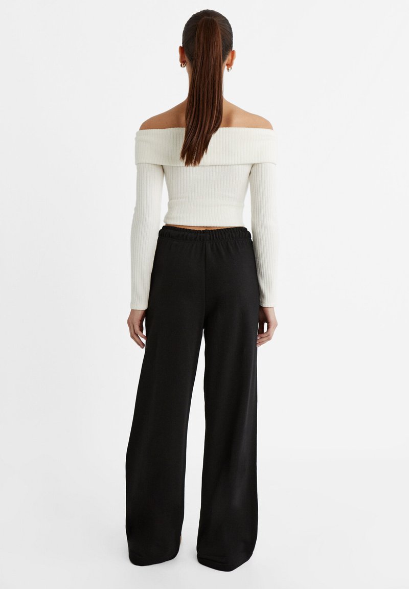 Stradivarius Stradivarius WIDE-LEG JOGGER - Tracksuit bottoms - black Nur noch ein Tag übrig