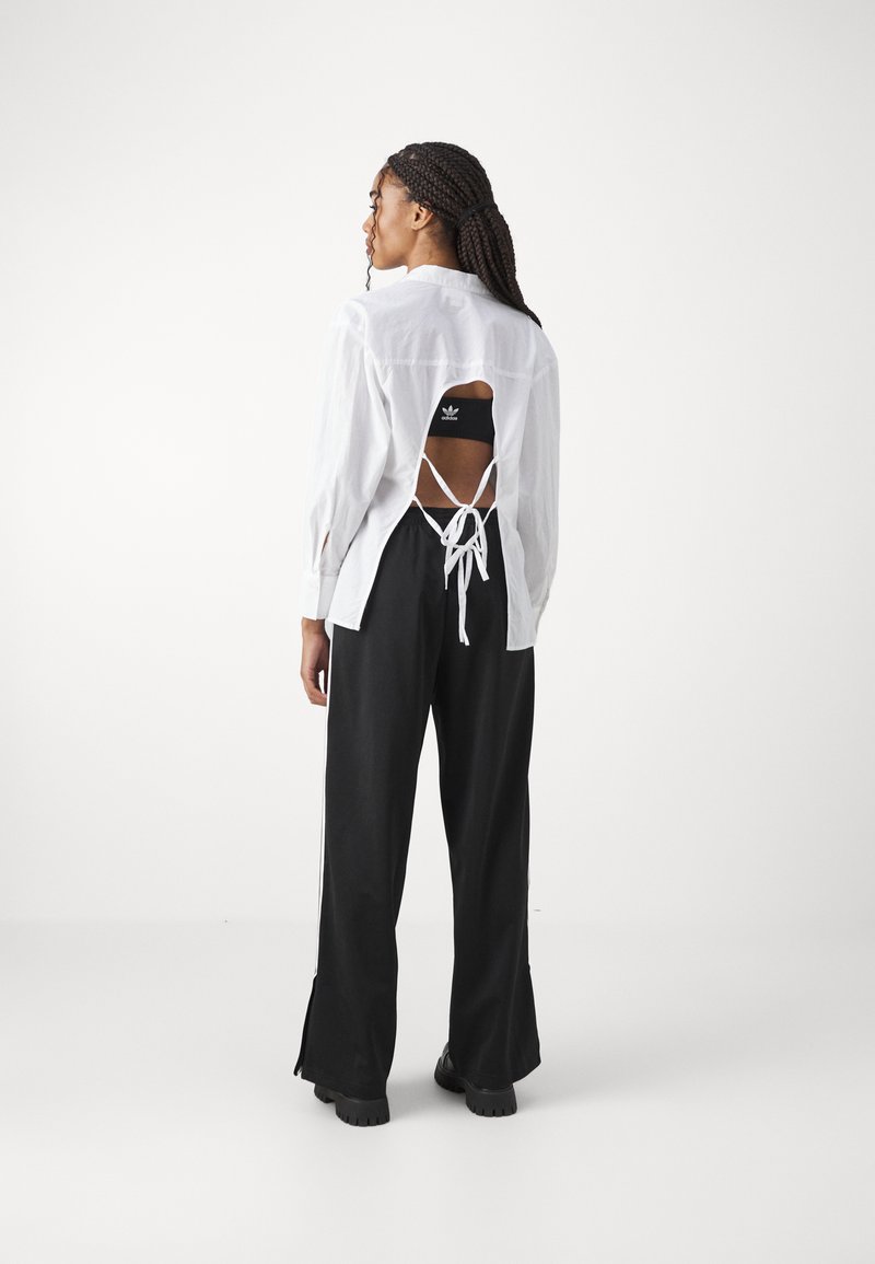 adidas Originals adidas Originals FBIRD LOOSE - Tracksuit bottoms - black Letzte 3 Tage