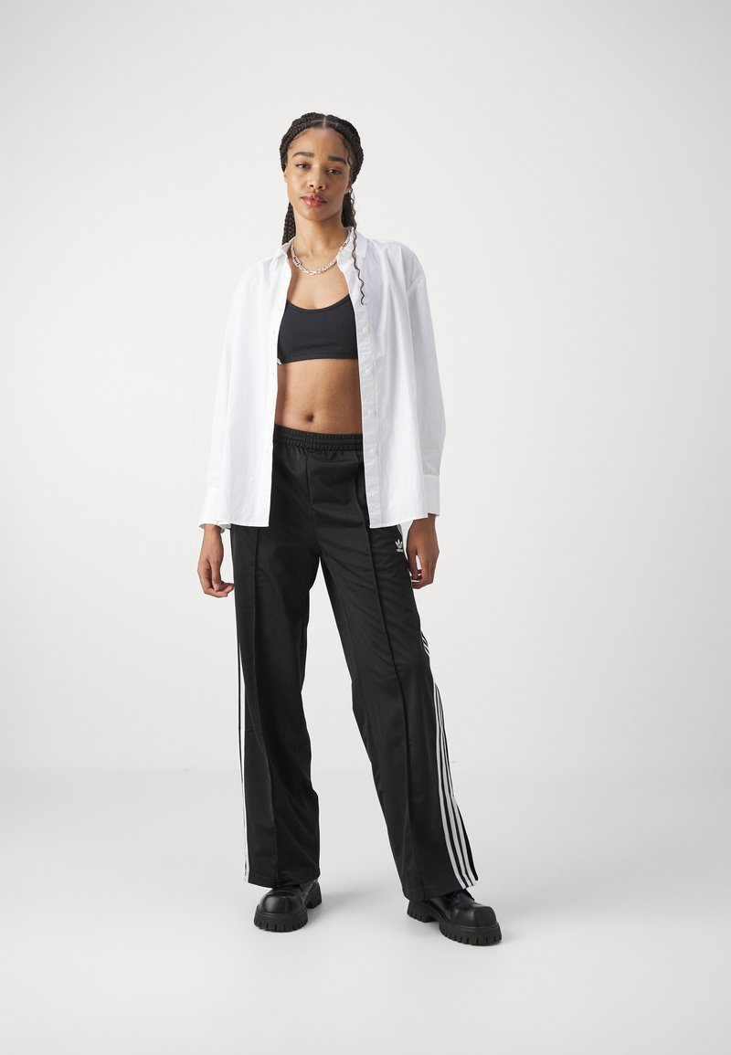 adidas Originals adidas Originals FBIRD LOOSE - Tracksuit bottoms - black Letzte 3 Tage