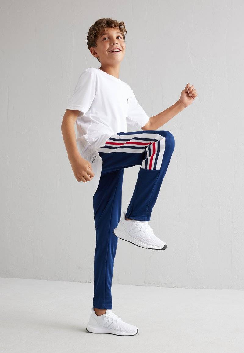 adidas Performance adidas Performance TIRO NATIONS PACK UNISEX - Tracksuit bottoms Fabrikladen
