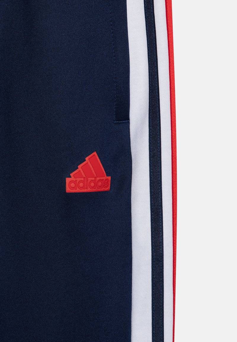 adidas Performance adidas Performance TIRO NATIONS PACK UNISEX - Tracksuit bottoms Fabrikladen