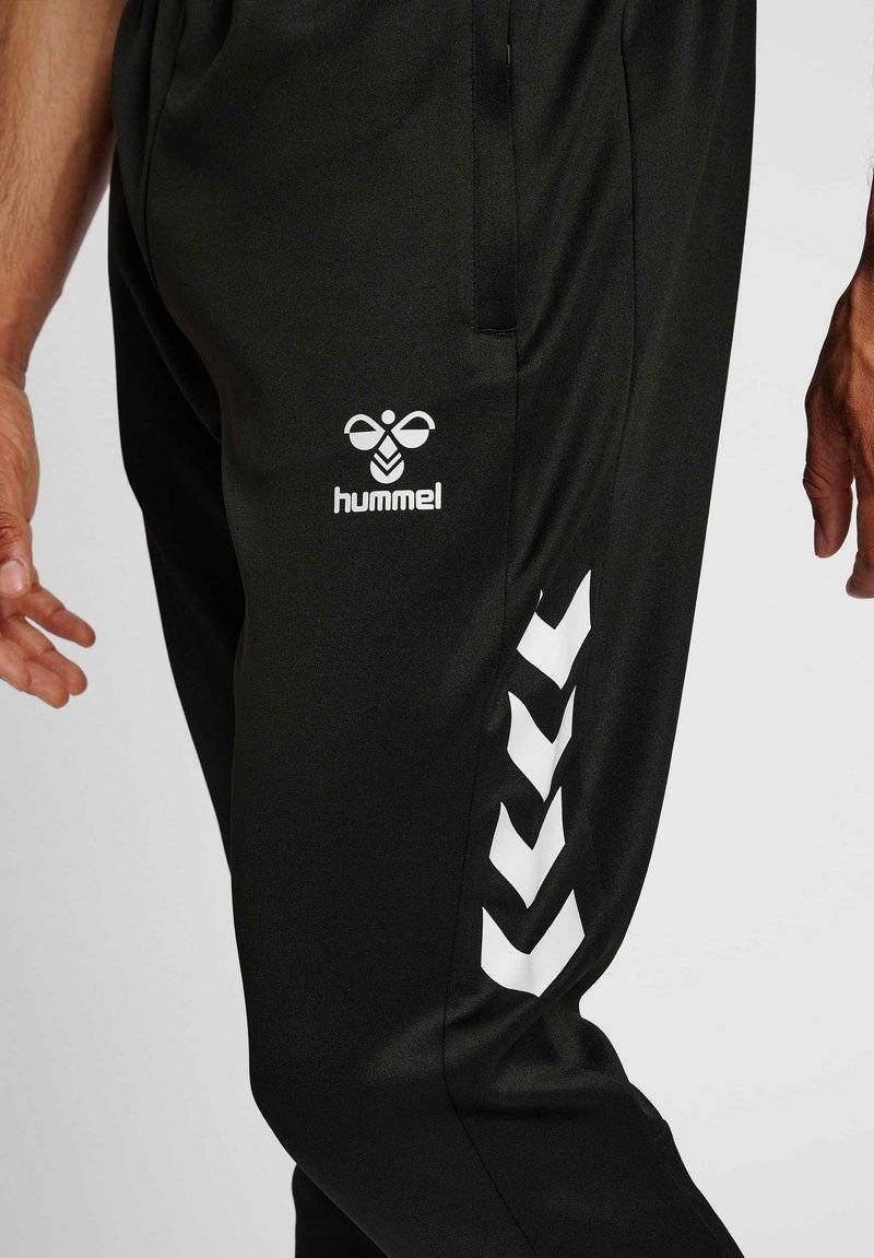 Hummel Hummel CORE XR TRAINING PANTS - Tracksuit bottoms - black zollfrei