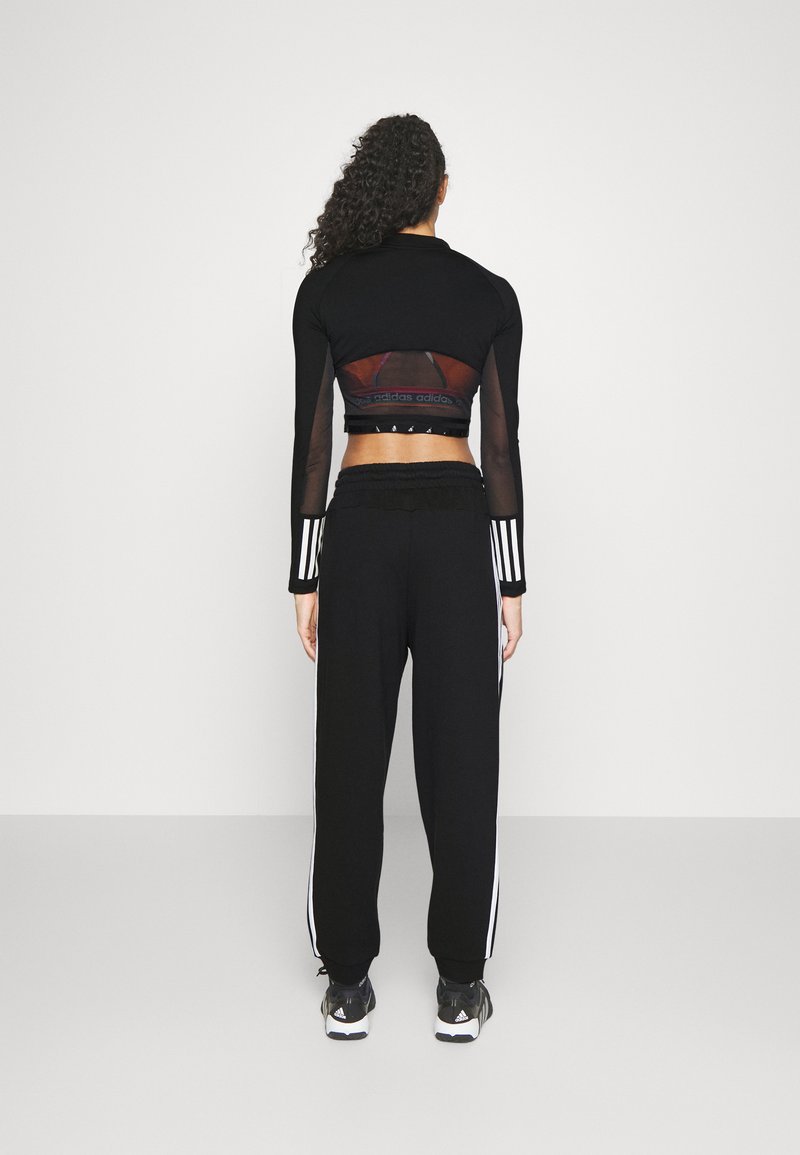 adidas Sportswear adidas Sportswear ESSENTIALS 3-STRIPES LOOSE-FIT - Tracksuit bottoms Günstiger Verkauf