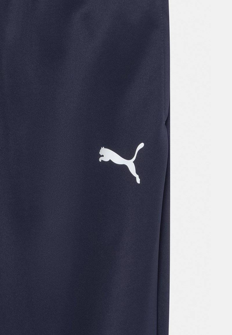 Puma Puma TEAMRISE POLY TRAINING UNISEX - Tracksuit bottoms Clearance-Verkauf