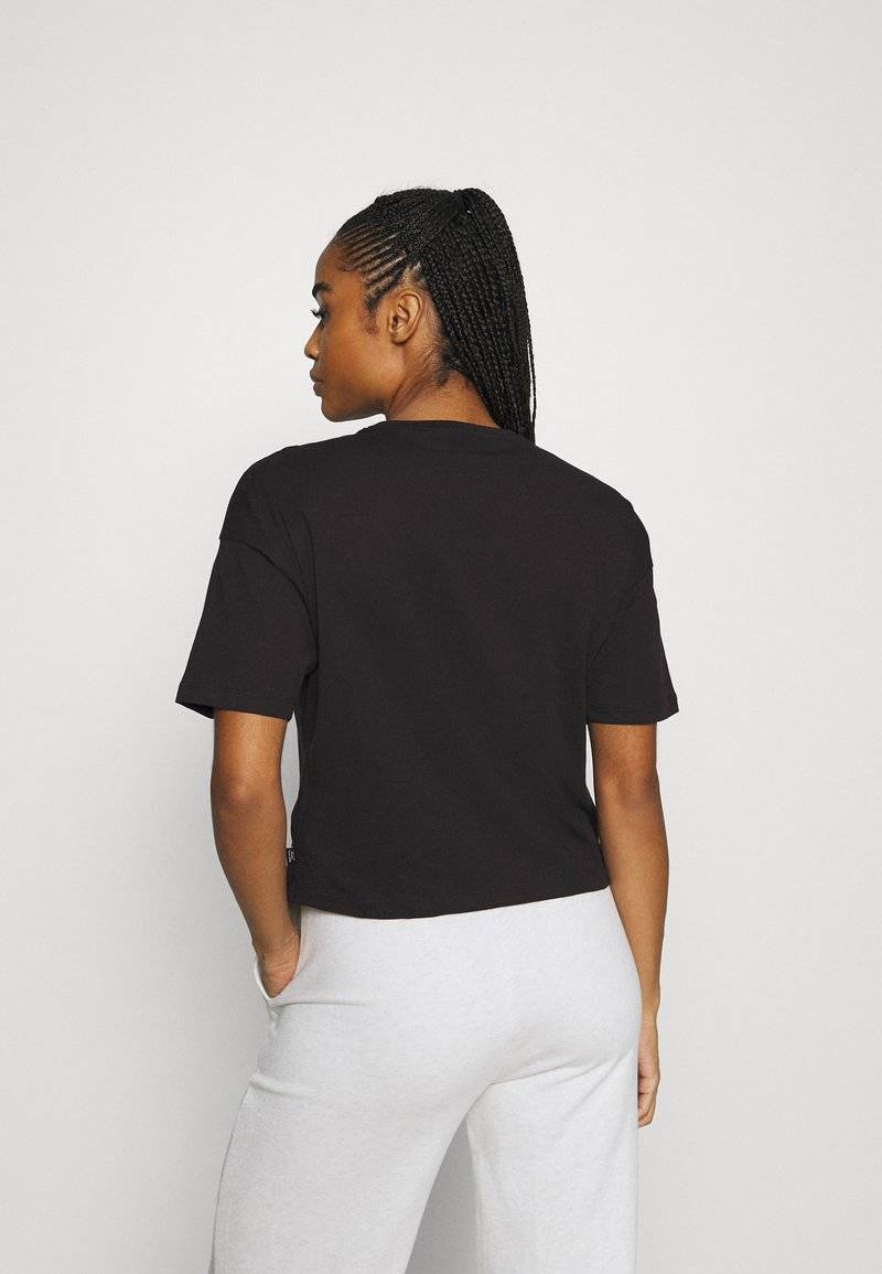 Puma Puma CROPPED LOGO TEE - Print T-shirt - puma black Online