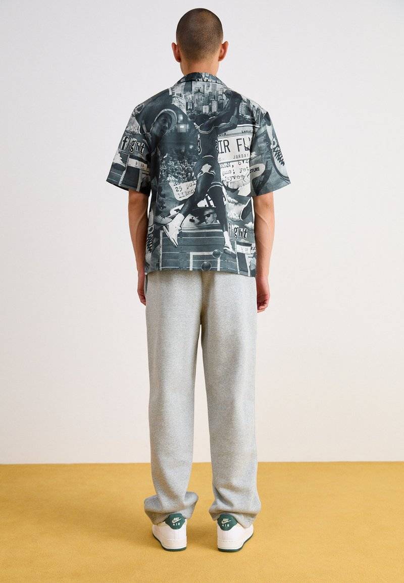 Nike Sportswear Nike Sportswear BUNGIE PANT - Tracksuit bottoms - grey heather Muttertagsangebot