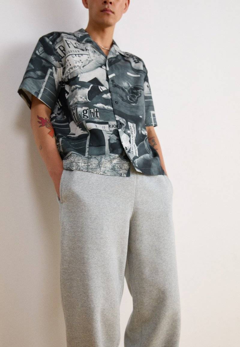 Nike Sportswear Nike Sportswear BUNGIE PANT - Tracksuit bottoms - grey heather Muttertagsangebot