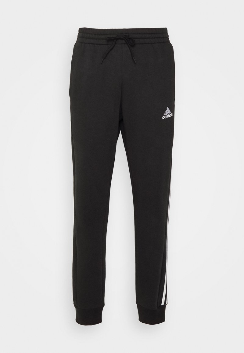 adidas Sportswear adidas Sportswear ESSENTIALS TAPERED CUFF 3 STRIPES PANTS - Tracksuit bottoms - black white 2025