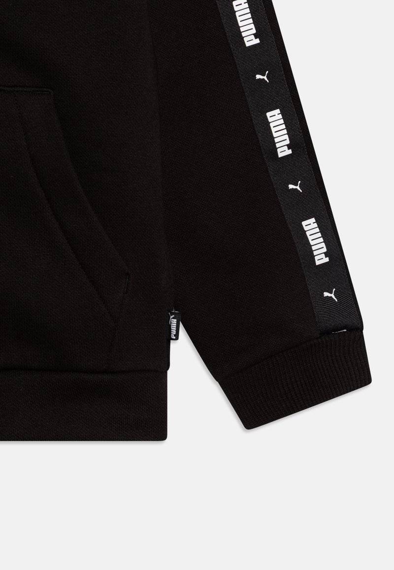 Puma Puma TAPE SWEAT SUIT UNISEX SET - Tracksuit - black Angebote