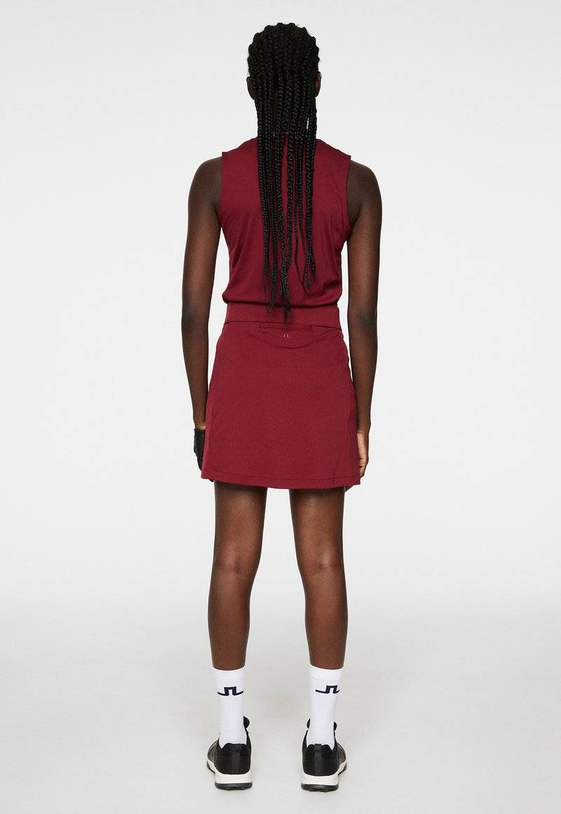 J.LINDEBERG Sports J.LINDEBERG Sports AMELIE MID - Sports skirt - cabernet Versandkostenfrei