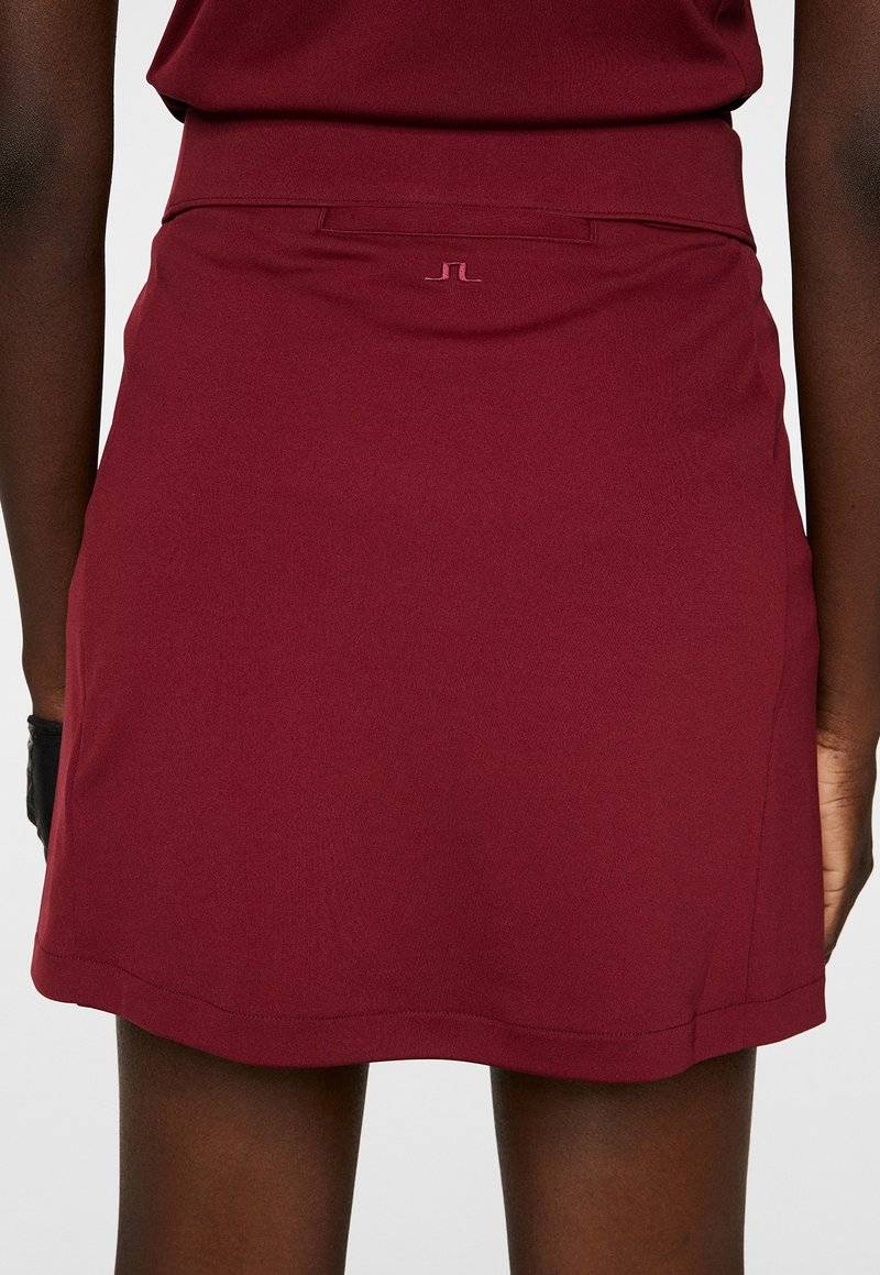 J.LINDEBERG Sports J.LINDEBERG Sports AMELIE MID - Sports skirt - cabernet Versandkostenfrei