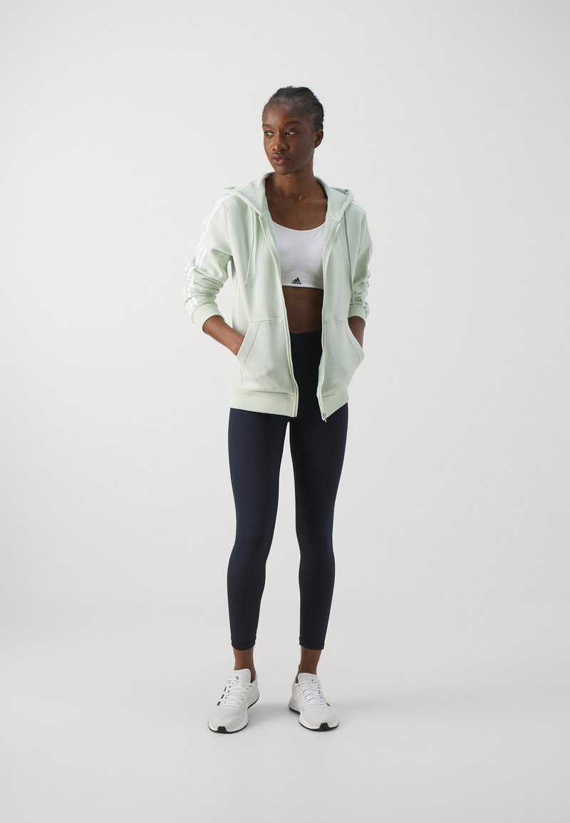 adidas Sportswear adidas Sportswear ESSENTIALS 3 STRIPES FULL ZIP HOODIE - Zip-up sweatshirt - linen green Lagerräumung