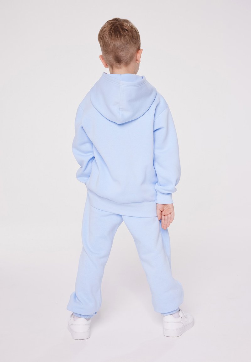 Champion Champion EXCLUSIVE PANT UNISEX - Tracksuit bottoms - light blue Saisonschlussverkauf