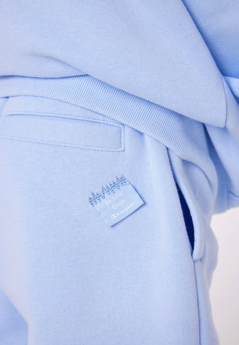 Champion Champion EXCLUSIVE PANT UNISEX - Tracksuit bottoms - light blue Saisonschlussverkauf