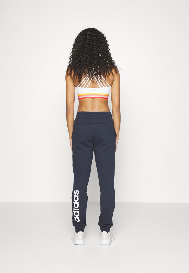adidas Sportswear adidas Sportswear ESSENTIALS LINEAR CUFFED - Tracksuit bottoms - legend ink Saisonale Angebote