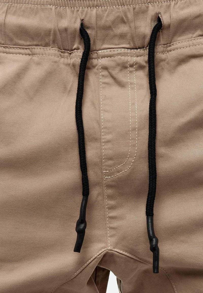 Tazzio Tazzio Cargo trousers - beige Wochenangebot