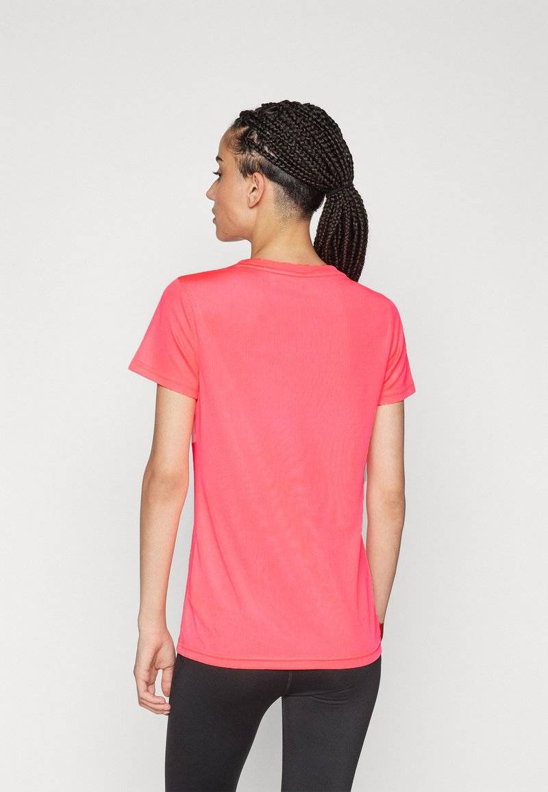 Puma Puma PERFORMANCE TEE - Sports T-shirt - sunset glow Super Rabatt