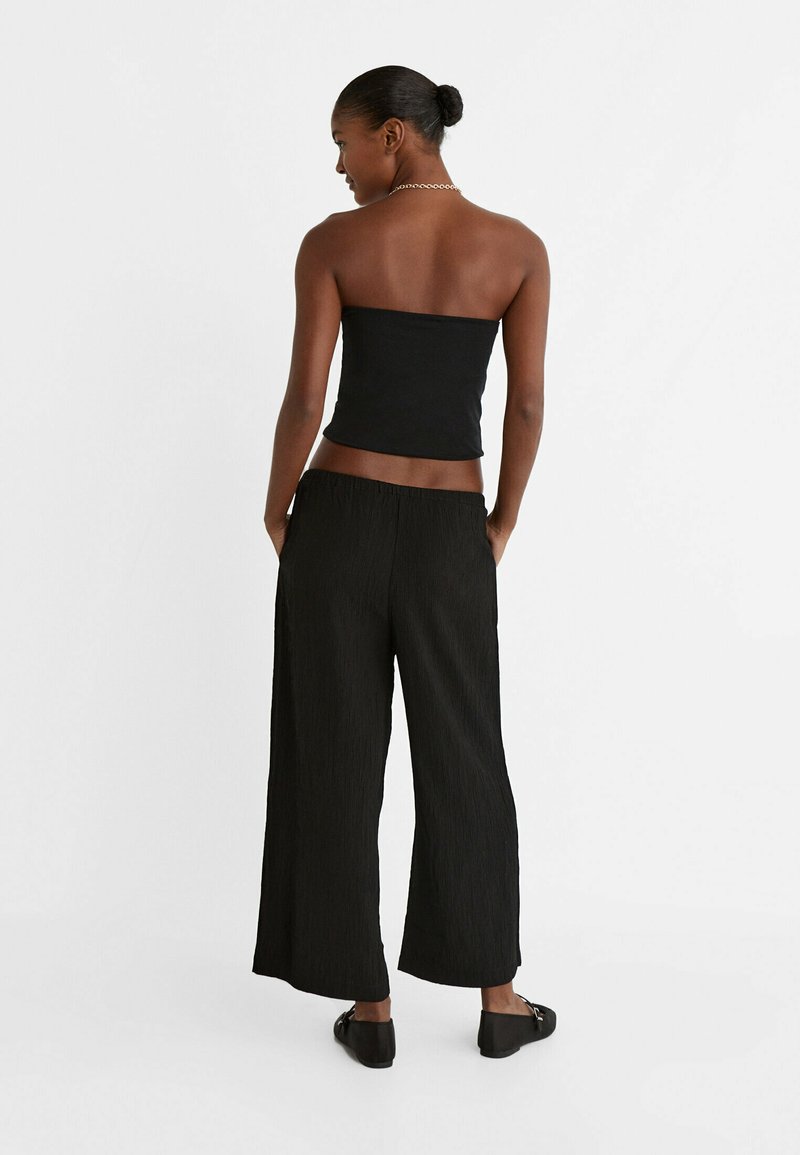 Stradivarius Stradivarius FLOWING CULOTTES - Trousers - black 50% Rabatt mit kostenlosem Versand